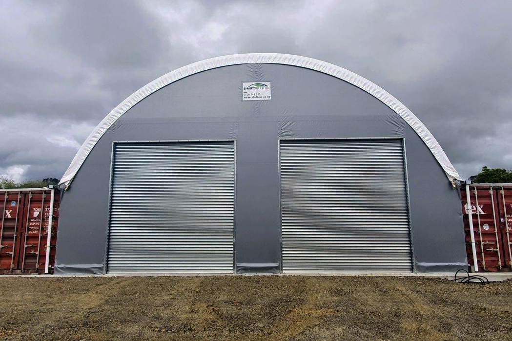 Grey fabric building with double steel roller doors