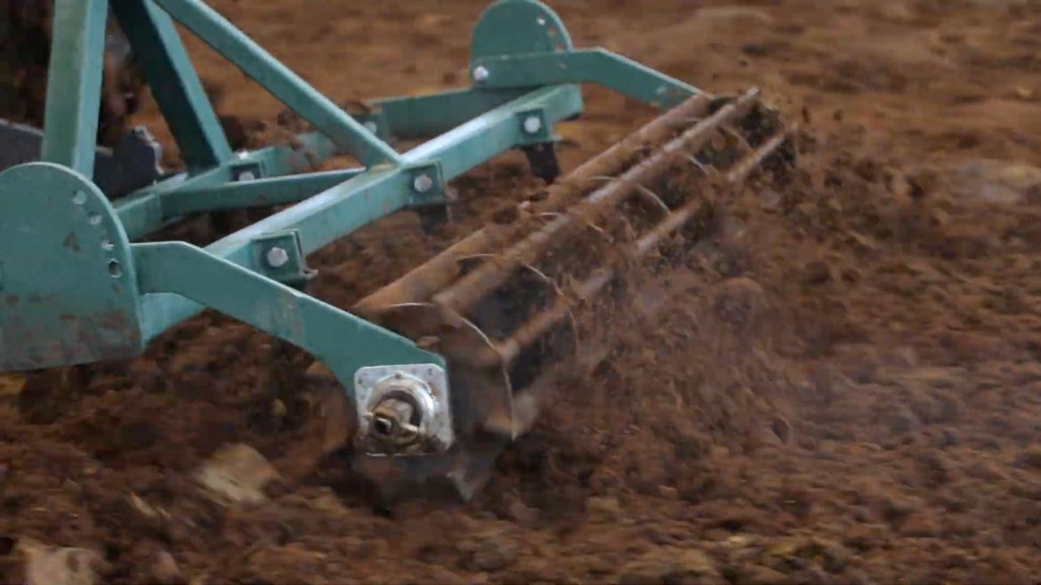 readale farm composting barn video testimonial close up of tractor ripping dirt