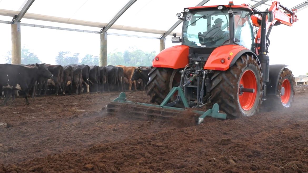 readale farm composting barn video testimonial tractor ripping dirt as cows feed